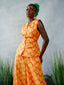 FSS Icon Print Linen Pants Set half front view. Orange print linen co-ord by For Style's Sake